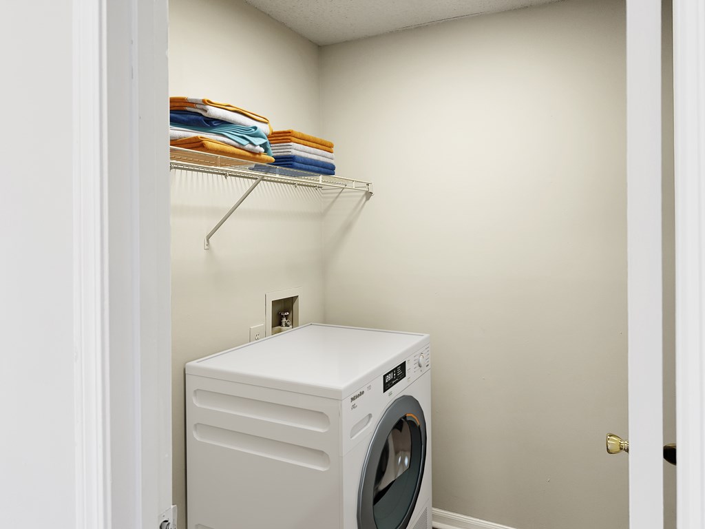 a laundry room with a washer and dryer
